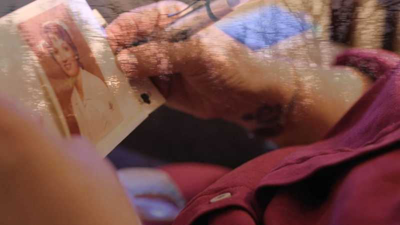Lonni Schicker is holding an image of herself when she worked as a nurse's aide and a technician in the burn unit at what was then St. John's Mercy Medical Center.